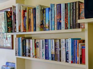 a book shelf filled with lots of books at 2 Bed in Lampeter oc-43293 in Tregaron