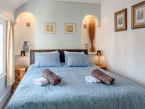 a bedroom with a bed with two pillows on it at 1 Bed in Presteigne oc-55285 in Presteigne