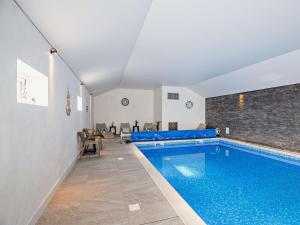 a swimming pool in the middle of a room at 5 Bed in Denbigh oc-86009 in Llandyrnog