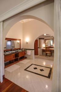 an archway in a kitchen with a dining room at Ocean Beach Resort & SPA in Malindi