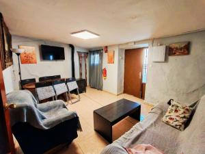a living room with a couch and a table at Casa Serrana in Quesada