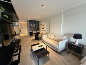 a living room with a couch and a table at Deco Recoleta in Buenos Aires