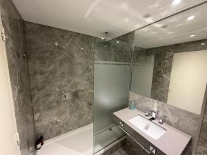 a bathroom with a sink and a shower at Deco Recoleta in Buenos Aires