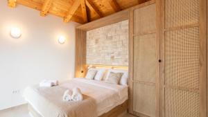 a bedroom with a bed with two towels on it at Villa Silvana by Villas Guide in Blato +31 photos