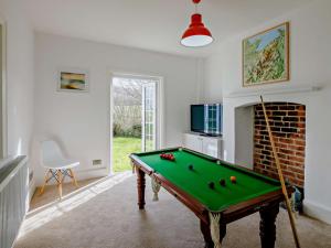 a living room with a pool table in it at 6 Bed in Abergele oc-91054 in Llanddulas