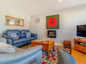 a living room with a couch and a table at 2 Bed in Cromer oc-29556 in Cromer