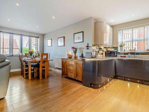 a kitchen and dining room with a table in it at 2 Bed in Cromer oc-29556 in Cromer
