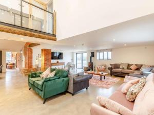 a large living room with couches and a couch at 14 Bed in Welshpool oc-90568 in Berriew