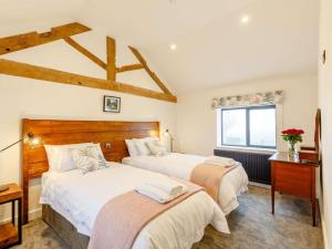 a bedroom with two beds and a window at 14 Bed in Welshpool oc-90568 in Berriew +82 photos