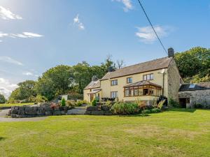 a house with a large yard in front of it at 5 Bed in Aberystwyth oc-58889 in Llanrhystyd