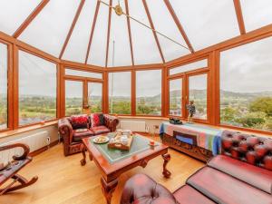 a living room with a large glass ceiling at 3 Bed in Corwen oc-90459 in Corwen