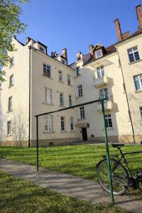 a bike parked in front of a building at PIASKI 4 - Boutique stay in Gdańsk