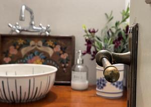 a sink with a faucet and a bowl on a table at Aphrodite's Coast Retreat House! in Galaxidi