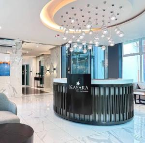 a lobby with a kazania sign in the middle at JI Homestaycation in Manila +16 photos