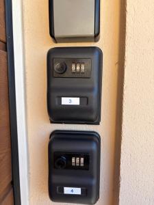 two electronic devices on the side of a wall at Apartment 3 Stavební in Cheb