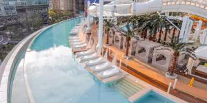 a pool on a cruise ship with a water slide at Haeundae Beach Stay Hotel in Busan