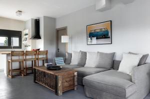 a living room with a couch and a coffee table at Ammos Boutique Villa in Elafonisos