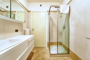 a bathroom with a shower and a sink at Sergio's house in Como
