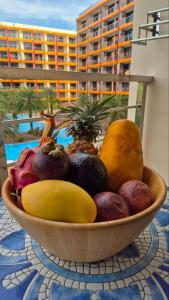a bowl of fruit on top of a table at PB329 Phuket's best oceanfront studio in Ban Mai Salae