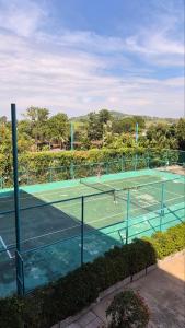 a tennis court with two people on it at PB329 Phuket's best oceanfront studio in Ban Mai Salae