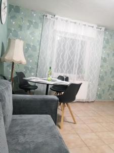 a dining room with chairs and a table with a lamp at Schöne Wohnung Prima am Bahnhof Schwerte in Schwerte