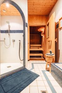 a bathroom with a shower and a tub at Apart Zimalis in Galtür +69 photos
