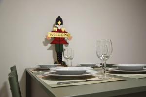 a table with glasses and a cake on top of it at Ponte House in Piaia +20 photos