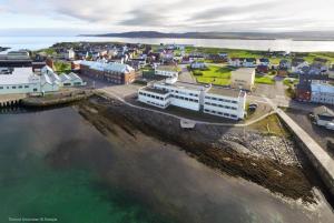 an aerial view of a town next to the water at Vardø Hotel by Destination Vardø in Vardø
