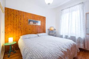 A bed or beds in a room at Appartamento Ciliegio Le Regine
