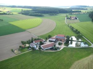 an aerial view of a house in a field at Gschwandnerhof in Michelsneukirchen