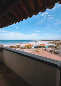 a view of the beach from a balcony at Acuario Pousada in Arraial do Cabo