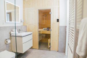 a small bathroom with a sink and a toilet at Küste33 34 in Tossens +19 photos