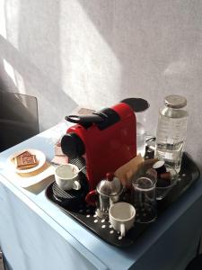 a tray with a coffee maker on a table at chambre Marseille pas lon de saint Charles et vieux port in Marseille