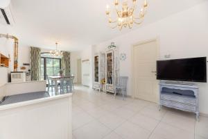 a large living room with a flat screen tv at Sale Marino - Goelba in Capoliveri