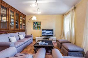 TV a/nebo společenská místnost v ubytování Il Palazzo