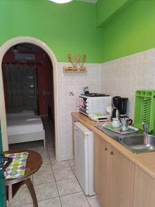 a kitchen with a sink and a counter top at Ground floor economy studio in karmiris studios in Zakynthos