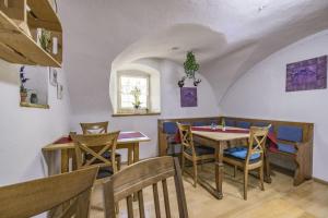 a dining room with a table and chairs at Pension Lex in Bad Reichenhall