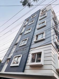 a tall blue building with white windows at Deccan Homes Kondapur in Hyderabad