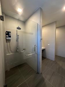 a shower with a glass door in a bathroom at Pearlix Koh Mook in Ko Mook
