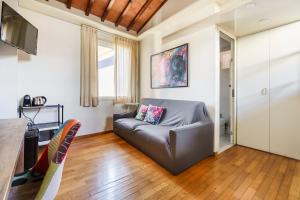 a living room with a couch and a table at Corso Double in Florence