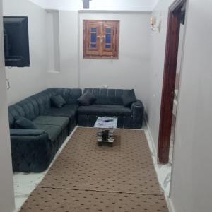 a living room with a couch and a table at Dakhly siwa in Siwa