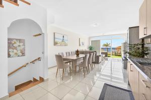 a kitchen and dining room with a table and chairs at Villa Brisa Serena - Oceanfront - Los Cristianos in Los Cristianos
