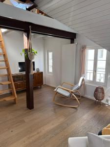a living room with a loft bed and a couch at Apartment in Düdingen in Düdingen