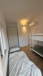 a small bedroom with a bed and a bunk bed at Casa Paradiso La Cinta San Teodoro in San Teodoro +44 photos