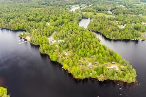 an island in the middle of a body of water at Långasjönäs Camping & Stugby in Karlshamn