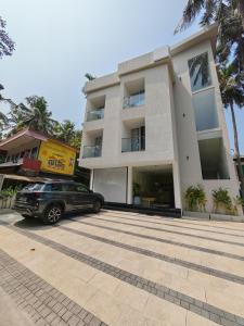 a car parked in front of a building at The Zen Retreat in Kozhikode