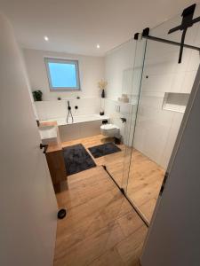 a bathroom with a shower and a toilet at Ferienwohnung Schöne Aussicht in Löf +34 photos