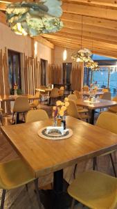 a dining room with a table and chairs at Hotel Clasic in Sebeş