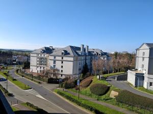 arial view of a city with buildings and a street at Premiere Classe Roissy Aéroport Charles De Gaulle in Roissy-en-France