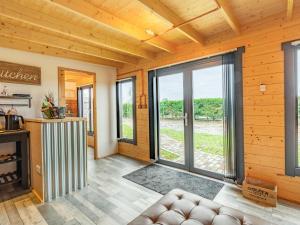 a living room with a large sliding glass door at Holly's Hidden Hideaway - Uk36783 in Sutton Valence +17 photos